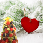 Beautiful fruit Christmas tree made with vibrant fresh fruits like strawberries, grapes, kiwi, and pineapple, arranged as a festive holiday centerpiece