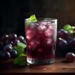 Homemade Grape Riot drink with mint and fresh grapes