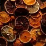 Dried orange slices and peels on a wooden surface