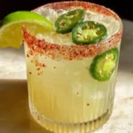 Pickled Jalapeño Margarita with salt rim and jalapeño garnish